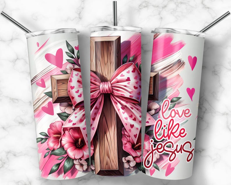 May include: A white tumbler with a pink and white design featuring a wooden cross with a pink bow and hearts. The text "love like jesus" is printed on the tumbler.