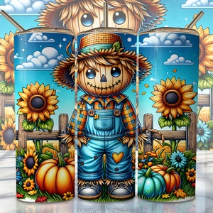 May include: A set of three stainless steel tumblers with a fall-themed design. The tumblers feature a cartoon scarecrow with a blue and yellow plaid shirt, blue overalls, and a straw hat. The background is a blue sky with white clouds and sunflowers.
