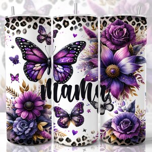 May include: A white tumbler with a purple and gold floral design, a large purple butterfly with glitter accents, and the word "mama" in black lettering. The background features a leopard print pattern.