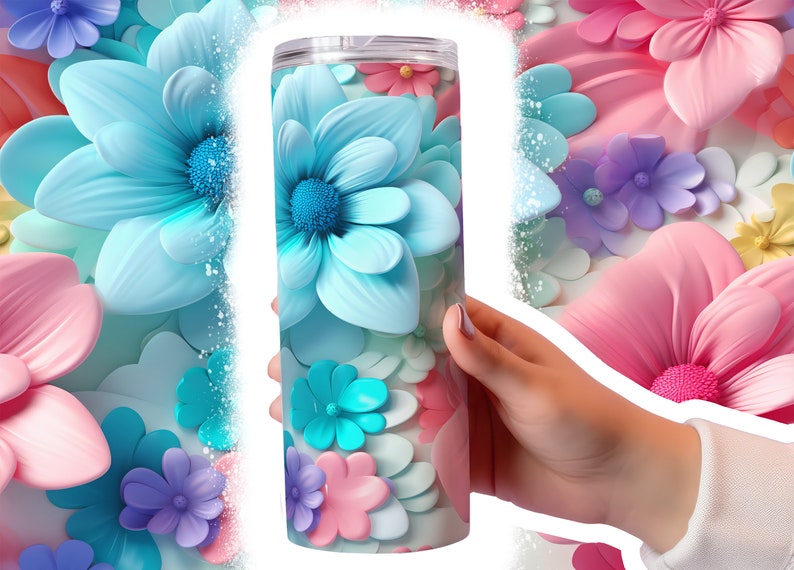 May include: A stainless steel tumbler with a colorful floral design. The tumbler features a variety of flowers in shades of blue, pink, and purple.