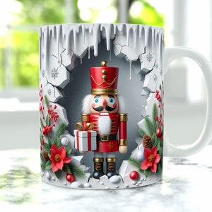 May include: White ceramic mug with a Christmas-themed design. The mug features a nutcracker holding a gift, surrounded by holly, pine branches, and snowflakes. The design is in a cracked ice effect.