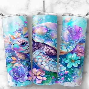 May include: A stainless steel tumbler with a colourful design featuring a sea turtle surrounded by flowers. The turtle has a blue, pink and purple shell with iridescent accents. The flowers are in shades of blue, pink and purple.