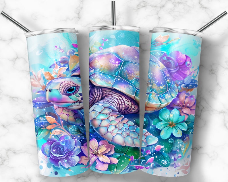 May include: A stainless steel tumbler with a colourful design featuring a sea turtle surrounded by flowers. The turtle has a blue, pink and purple shell with iridescent accents. The flowers are in shades of blue, pink and purple.