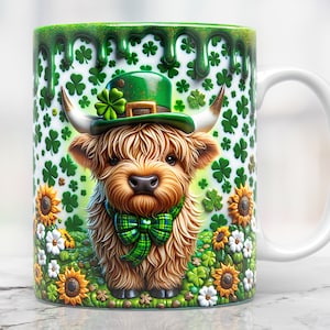 May include: A white ceramic mug with a green shamrock pattern and a cartoon highland cow wearing a green leprechaun hat. The mug has a green glaze that drips down the side.