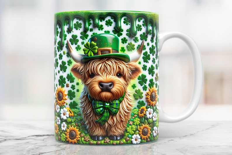 May include: A white ceramic mug with a green shamrock pattern and a cartoon highland cow wearing a green leprechaun hat. The mug has a green glaze that drips down the side.