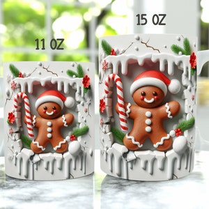 May include: Two white ceramic mugs with a gingerbread man design. The mugs are 11 oz and 15 oz. The gingerbread man is holding a candy cane and is surrounded by white icing and red and green holly.
