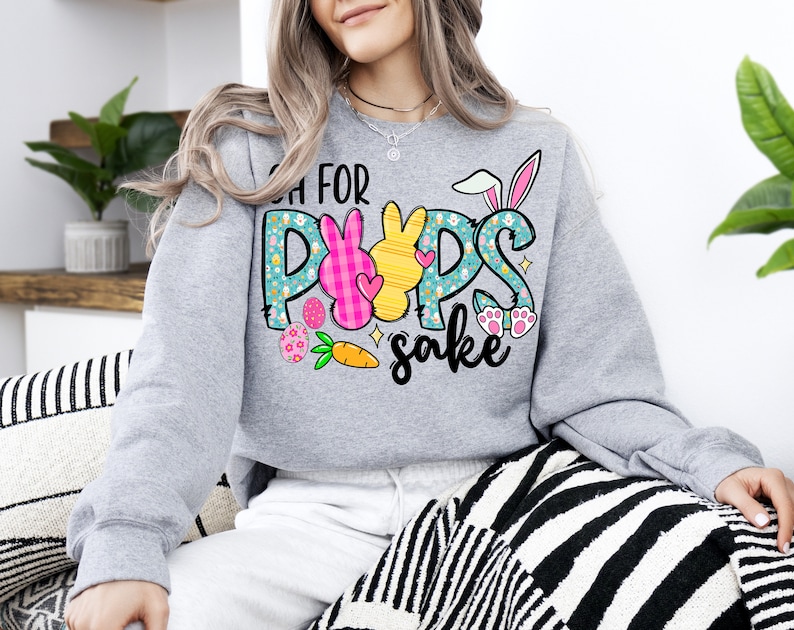 May include: Gray sweatshirt with a graphic of Easter bunnies and the text "Oh for POPS sake".