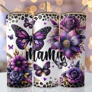 May include: Three stainless steel tumblers with a white background and a purple floral design. The tumblers feature butterflies, flowers, and the word "mama".
