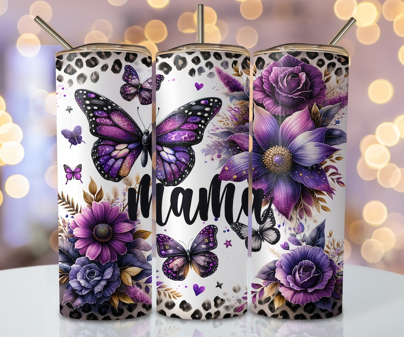 May include: Three stainless steel tumblers with a white background and a purple floral design. The tumblers feature butterflies, flowers, and the word "mama".