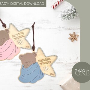 May include: Wooden star-shaped Christmas ornaments with sleeping teddy bears wrapped in pink and blue blankets. The ornaments say "Baby's First Christmas" and the year 2025. Digital download.