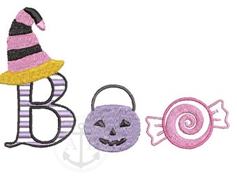 May include: A pink and black witch hat with a yellow brim, a purple pumpkin with a jack-o-lantern face, and a pink candy with a swirl design. The word "BOO" is spelled out in black and white striped letters.