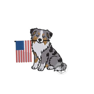 May include: An embroidered design of a cartoon dog, with a blue, gray, and brown coat, holding a small American flag in its mouth. The flag has red and white stripes and a blue square with white stars.