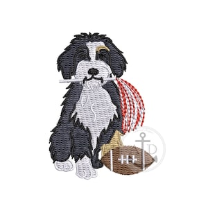May include: An embroidered design of a dog holding a pom-pom and a football. The dog is black, white, and tan. The pom-pom is red and white, and the football is brown. The design is on a white background.