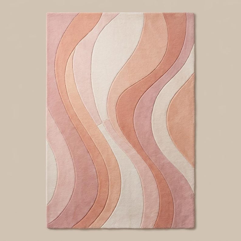 Contemporary pink abstract area rug styled under chair with soft pastel tones for modern minimalist home decor