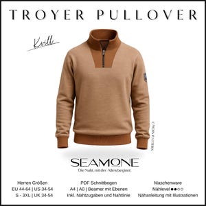 Puede incluir: Un jersey Trover marrón con cuello alto y cierre de cremallera de un cuarto. La parte superior del pecho y el cuello son de color marrón más oscuro. El texto "TROYER PULLOVER" está en la parte superior. La marca "SEAMONE" está en la parte inferior.