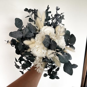 Beautiful bridal bouquet made of dried flowers with Infinity Rose, corsage