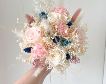 Beautiful bridal bouquet of dried flowers with infinity rose, boutonniere