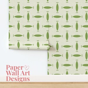 May include: A roll of wallpaper with a repeating pattern of green oval shapes on a cream background. The words "Paper Wall Art Designs" are printed in pink script at the bottom left.