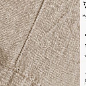 May include: Close-up of beige linen fabric with visible stitching. The image includes care instructions: machine wash at 30 degrees, do not dry, hang to dry, and steam ironing.