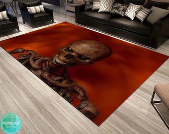 May include: A red and brown area rug with a 3D skull and skeleton design. The skull has a menacing expression with a large, toothy grin.