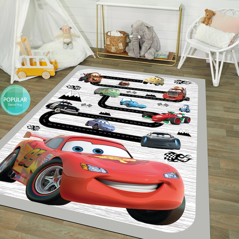 May include: A red, white, and black Cars themed play rug with a black race track and a large image of Lightning McQueen. The rug features other Cars characters like Mater, Francesco Bernoulli, and more.
