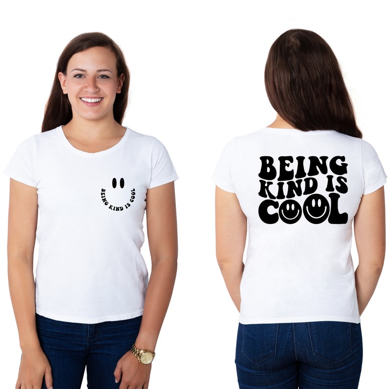 May include: White t-shirt with a black smiley face graphic and the text "Being Kind is Cool" on the front and back.