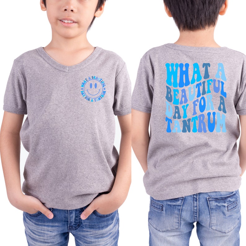 May include: Gray V-neck t-shirt with a blue smiley face on the front and the text "What a beautiful day for a tantrum" in blue on the back.