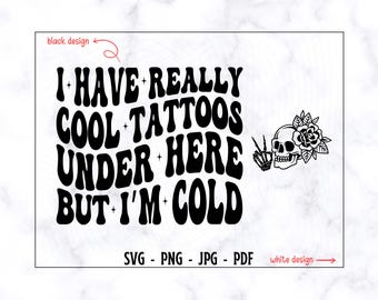 May include: Black and white graphic design with the text "I have really cool tattoos under here but I'm cold". A skull with a rose is in the top right corner.
