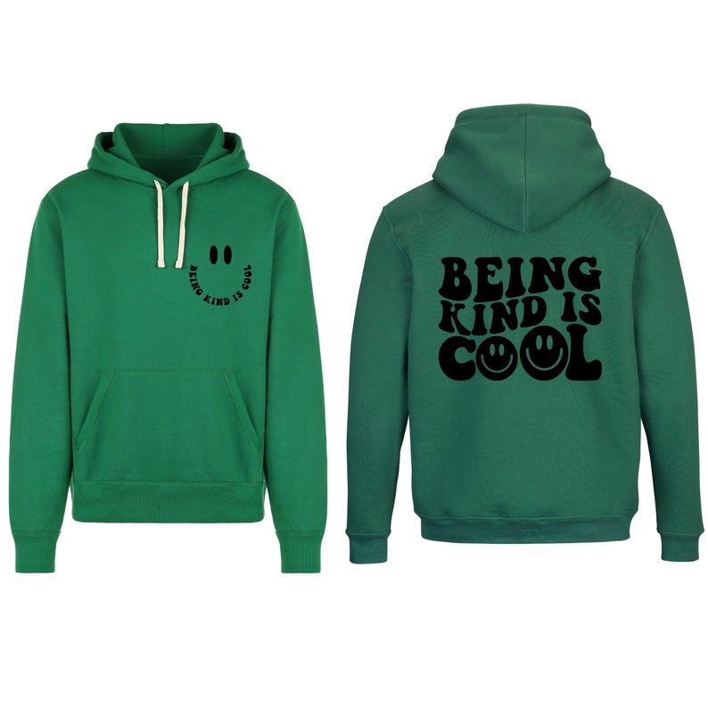 May include: Green hooded sweatshirt with the text "Being Kind Is Cool" in black with a smiley face graphic. The front of the sweatshirt has a smaller smiley face graphic with the text "Being Kind Is Cool".