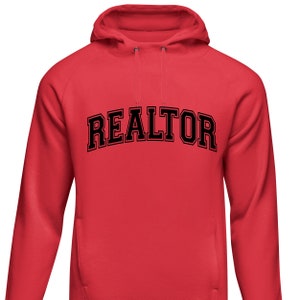 Peut inclure: Sweat-shirt &agrave; capuche rouge avec le mot "REALTOR" imprim&eacute; en noir sur le devant.