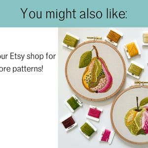 May include: Two embroidery hoops with fruit designs, a pear and an apple, are displayed. The pear is yellow, green, and pink, while the apple is green and pink. Spools of thread in various colors surround the hoops. Text reads: "You might also like: Visit our Etsy shop for more patterns!"