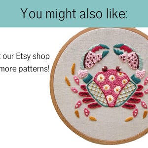 May include: Embroidered crab design in a wooden hoop. The crab features pink, teal, and yellow thread. The text "You might also like:" and "Visit our Etsy shop for more patterns!" are visible.