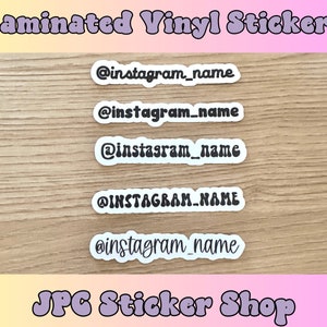 May include: Five white, laminated vinyl stickers with black text that reads "@instagram_name" in a retro font. The stickers are on a wood background. The text "JPC Sticker Shop" is in a retro font at the bottom of the image.