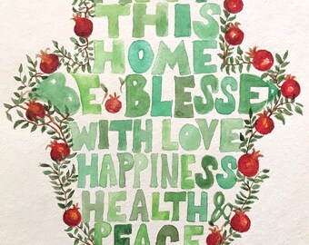 May include: Watercolor painting of a Hamsa hand shape with the words "MAY THIS HOME BE BLESSED WITH LOVE HAPPINESS HEALTH & PEACE" in shades of green. The design is framed with green leaves and red pomegranates.