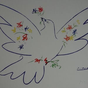 May include: A line drawing of a dove in flight with its wings spread wide. The bird is outlined in dark blue ink and decorated with small, colorful floral accents in red, yellow, and blue. The signature Picasso is visible in the bottom right.