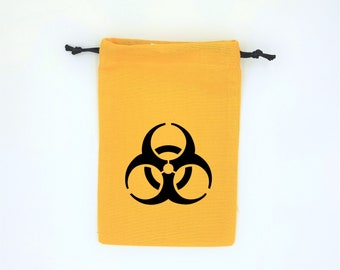 Bourse à dés plate inspirée de l'univers Fallout avec logo du risque biologique ou nucléaire couleur jaune et noir