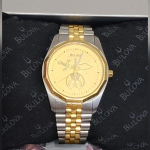 Vintage Bulova Men&#39;s Stainless Steel Gold Bezel Luxury Quartz Two Tone Water Resistant Masonry Symbol Watch