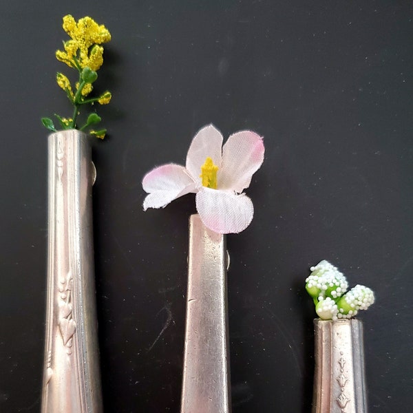 Bud vases cut from old vintage silverware - magnetized for hanging notes and displaying flowers and ephemera of all sorts.