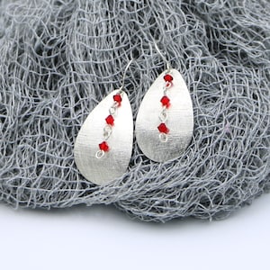 Handmade Textured Sterling Silver Oval Earrings with Red Swarovski Crystals