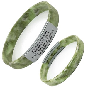 May include: Green silicone medical alert bracelet with a silver metal tag engraved with the text "Jackie Jackson, Diabetes Type 1, ICE: Johnny Johnson, 123-456-0987".