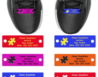 May include: Eight colorful shoe ID tags with a puzzle piece design. Each tag has the text "James Donaldson Autistic Non Verbal Mom: 222-222-2222".
