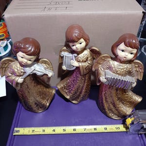 Vintage Golden Trio of Christmas Angel Figurines Playing Instruments Seasonal Décor