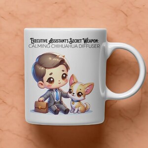 May include: White ceramic mug featuring a cartoon illustration of a person in a suit with a chihuahua. The mug has the text "Executive Assistant's Secret Weapon: Calming Chihuahua Diffuser". The mug has a curved handle.
