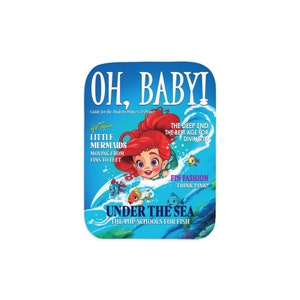 May include: A magazine cover featuring a cartoon mermaid on a blue wave. The cover reads "OH, BABY!" and "UNDER THE SEA". The text also says "Hot Topic" and "Little Mermaids".