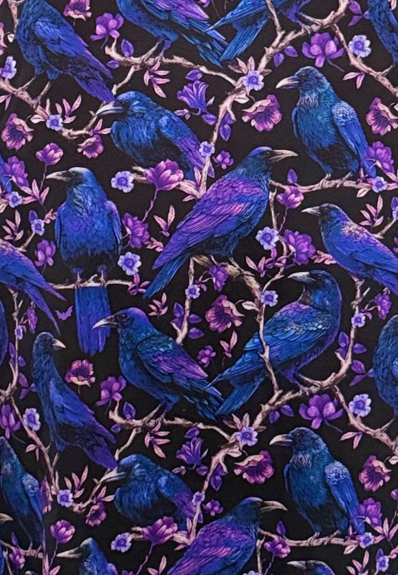 May include: A fabric pattern featuring multiple blue and purple ravens perched on branches with purple flowers against a black background. The ravens have detailed feathers and are in various poses.