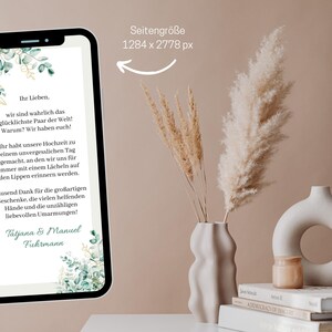 May include: A digital phone screen displaying a wedding announcement with a green and gold floral design. The text reads "Ihr Lieben. wir sind wahrlich das gl&uuml;cklichste Paar der Welt! Warum? Wir haben euch!" and "Tausend Dank f&uuml;r die gro&szlig;artigen Geschenke, die vielen helfenden H&auml;nde und die unz&auml;hligen liebevollen Umarmungen! Tatjana & Manuel Fuhrmann".
