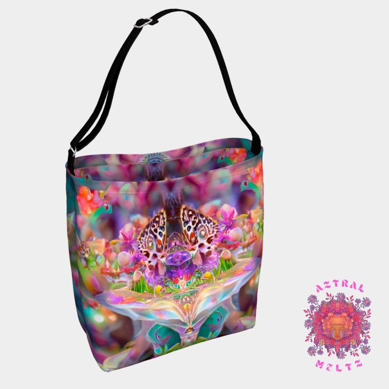 May include: A colorful tote bag with a psychedelic butterfly design. The bag has a black strap and is made of a durable fabric. The design features a variety of colors, including pink, purple, blue, green, and yellow.