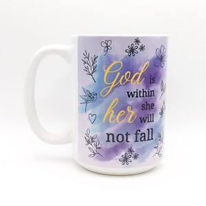 May include: White ceramic mug with a purple and blue watercolor design. The mug features the text "God is within her she will not fall" in black and gold lettering.