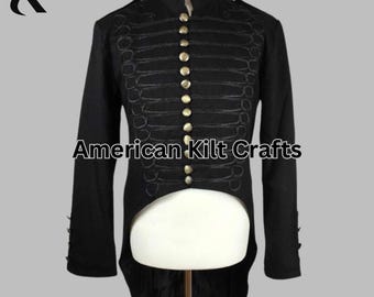 May include: Black military-style jacket with gold-colored buttons and decorative stitching. The jacket has a high collar and long sleeves. The text "American Kilt Crafts" is printed on the front.