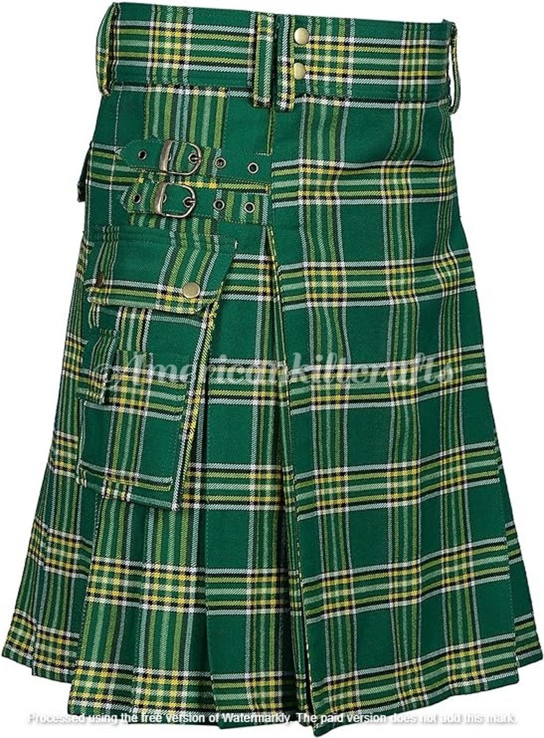May include: A green and yellow plaid kilt with a large cargo pocket on the front. The kilt has a belt with buckles and is pleated.